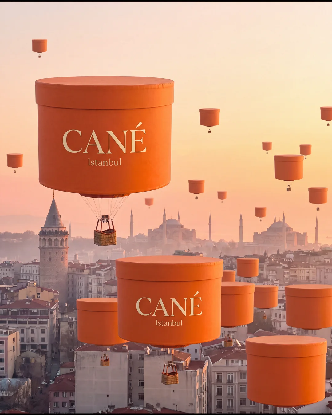 Hot air balloons shaped like CANÉ boxes over the Istanbul skyline
